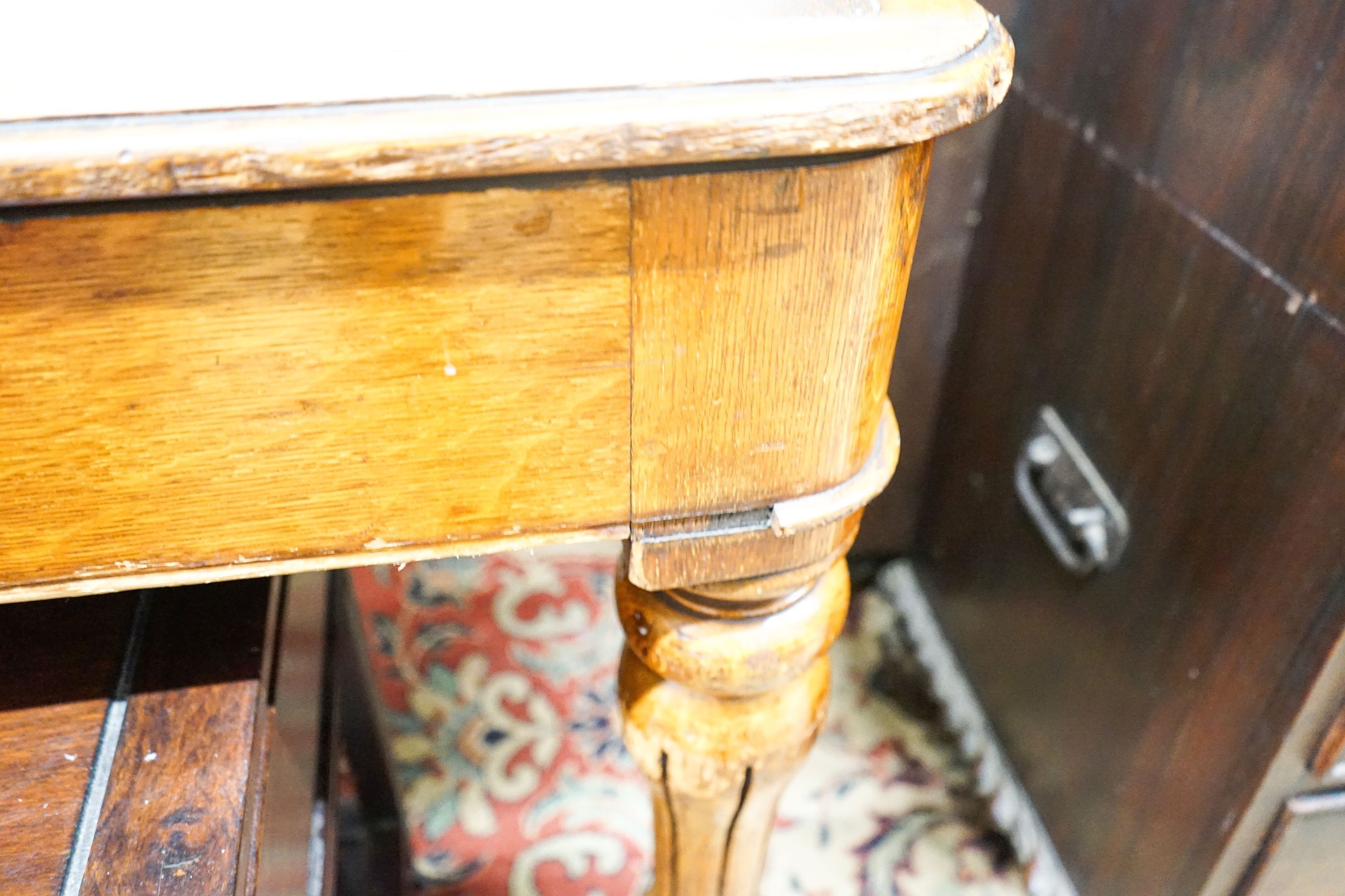 An early Victorian oak library table fitted two end drawers, from the Library of The Royal College of Surgeons, London, width 196cm, depth 105cm, height 76cm